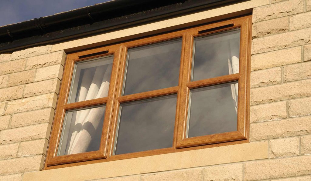 Oak colour casement windows replace old tired uPVC windows Bournemouth