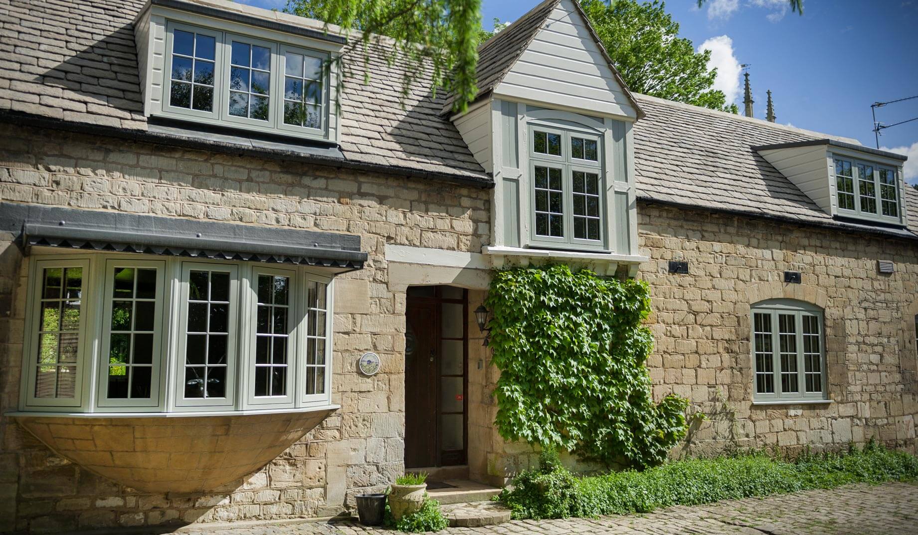Green uPVC timber effect residence 9 windows