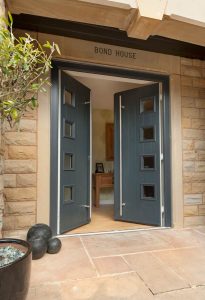 Double composite door with bar handle, 4 glazed window design in anthracite grey Poole