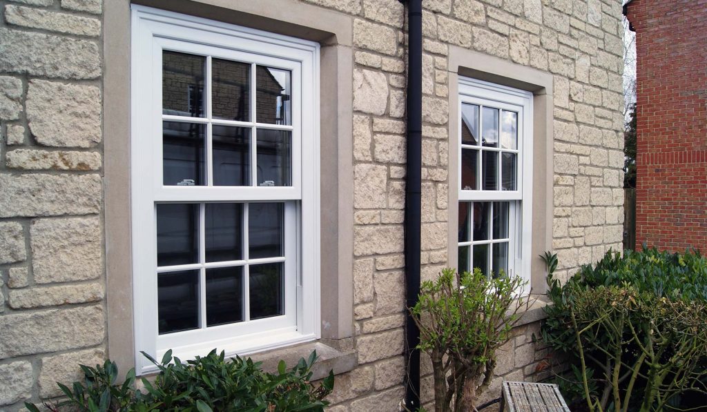 White authentic looking uPVC vertical sliding windows Portland