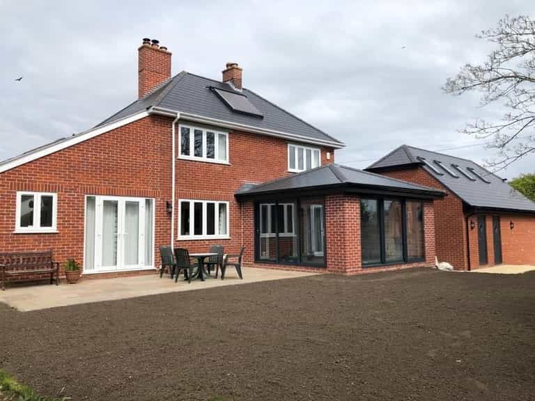 Brick house with orangery extension