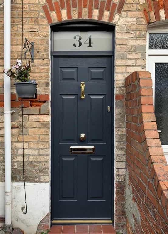Anthracite Grey, Tenby Solid from the Solidor collection with gold doctors knocker and furniture.