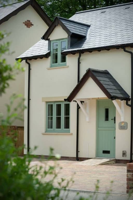 Chartwell green traditional flush sash windows installed into a modern property Weymouth